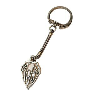 Gold-Tone Metal Keychain With Intricate Monogrammed Design And Spring Detail